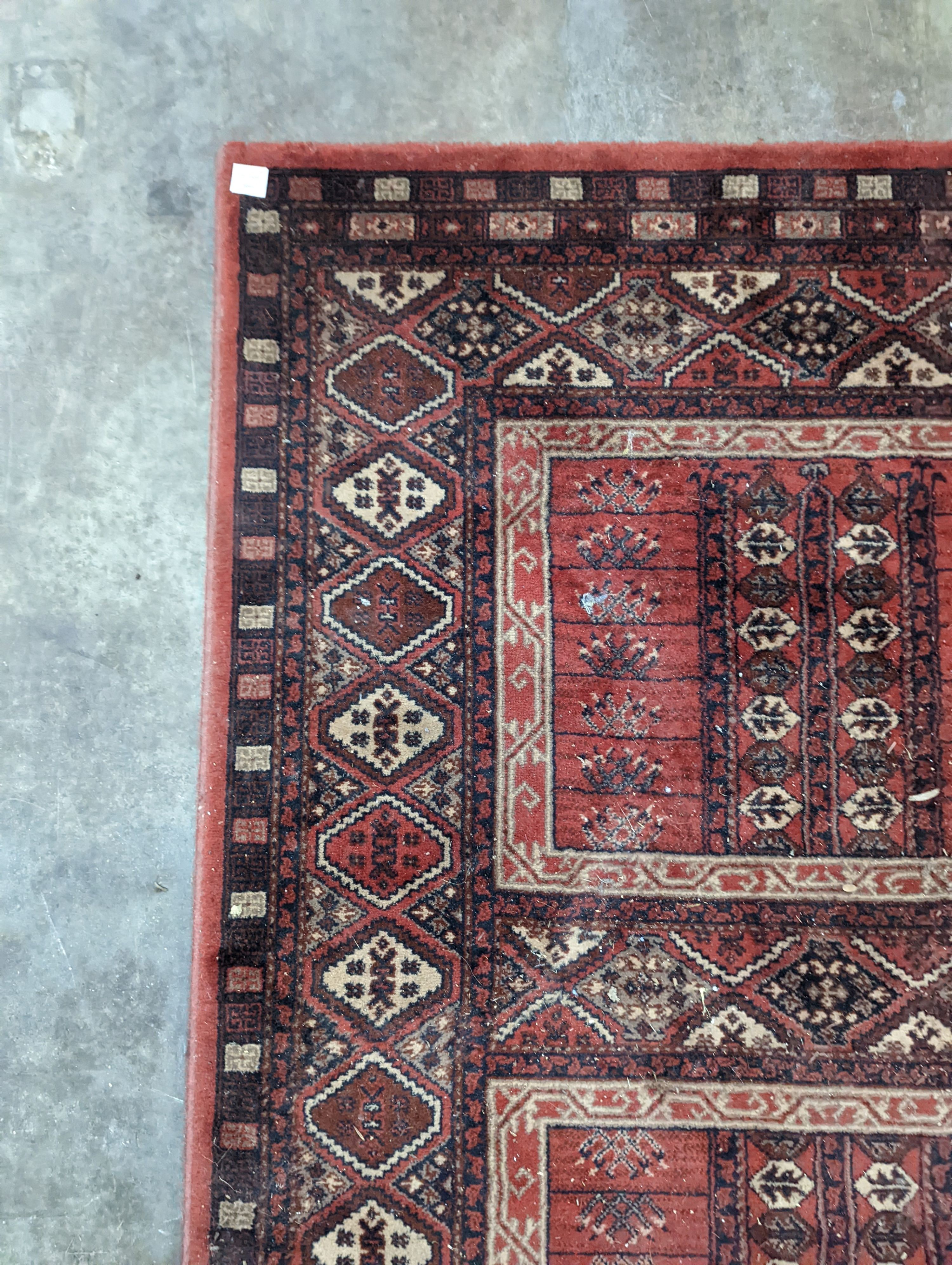 A Caucasian red ground rug, 190 x 136cm